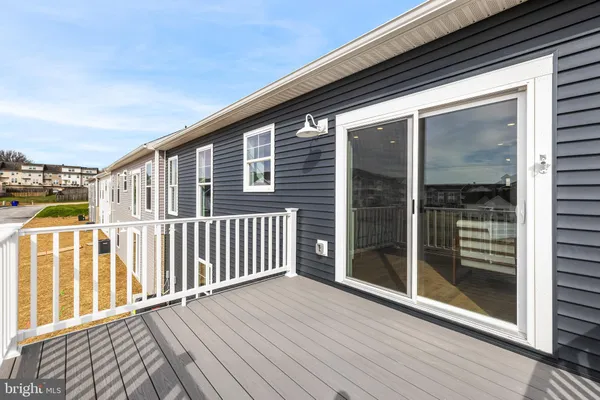 a view of a balcony with wooden floor