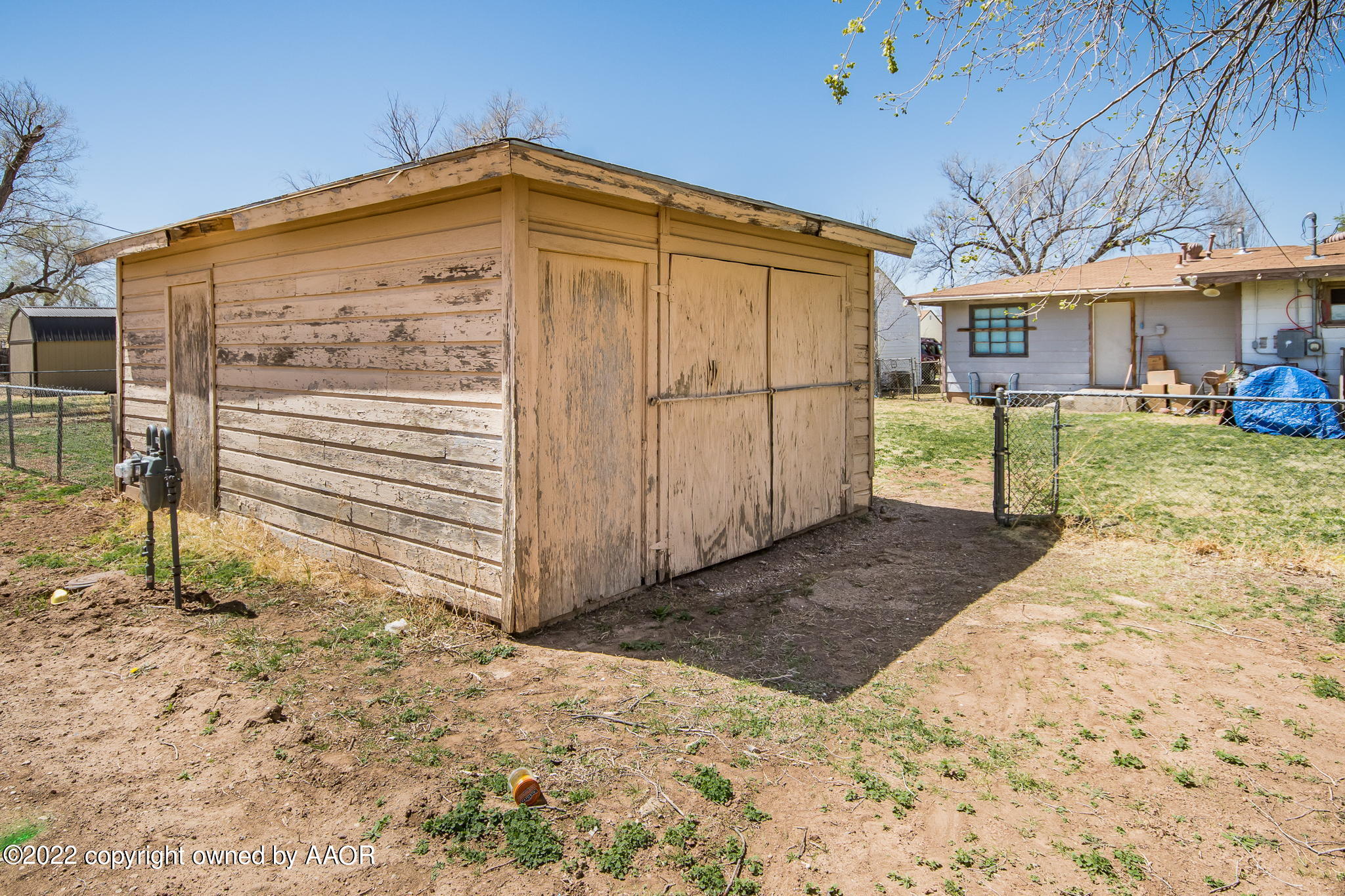 4409 South Travis Street Amarillo, TX 79110 - Photo 13 of 14 a view of a house with a yard