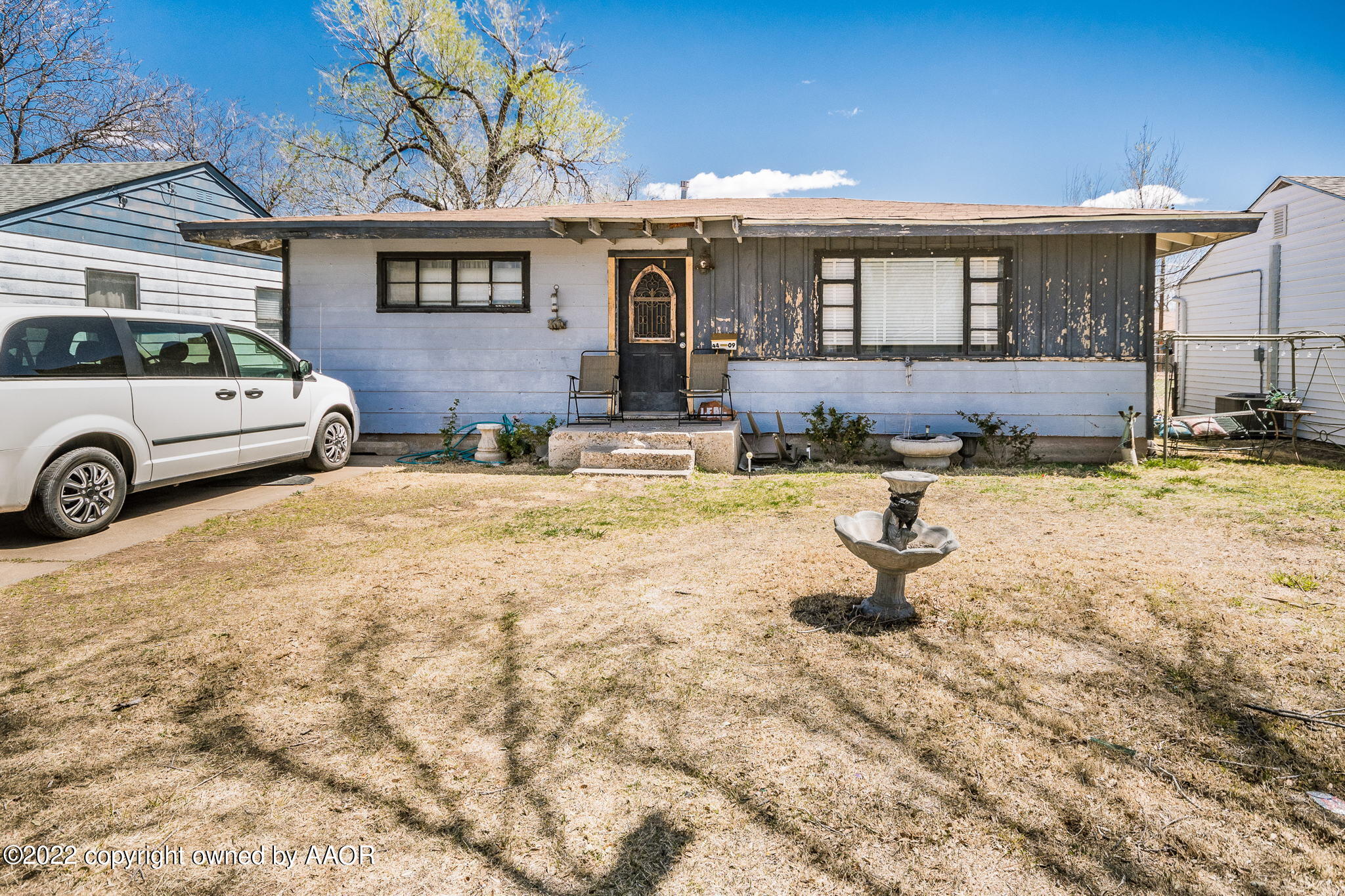 4409 South Travis Street Amarillo, TX 79110 - Photo 2 of 14 a front view of a house with swimming pool