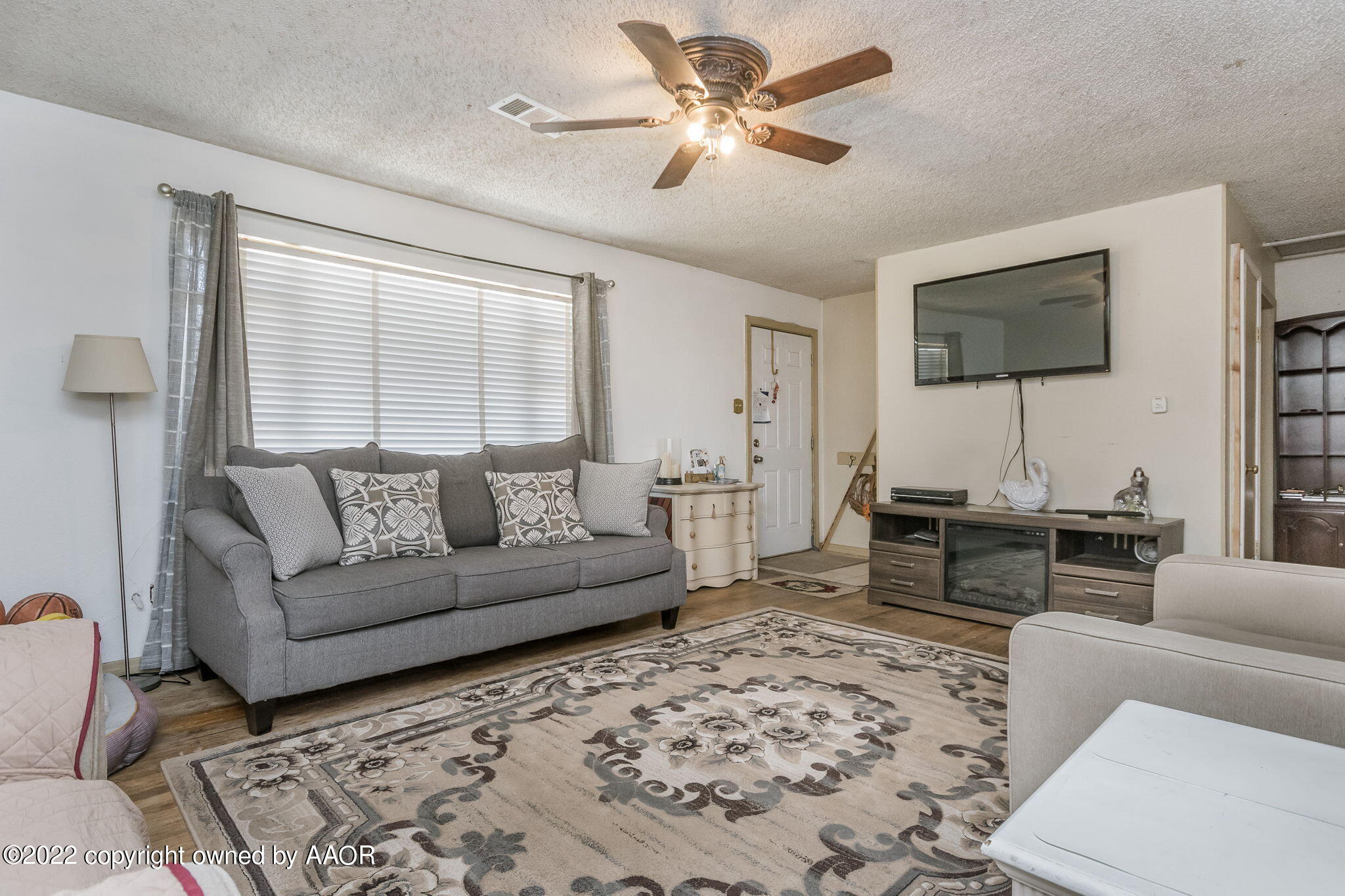 4409 South Travis Street Amarillo, TX 79110 - Photo 3 of 14 a living room with furniture a couch and a window