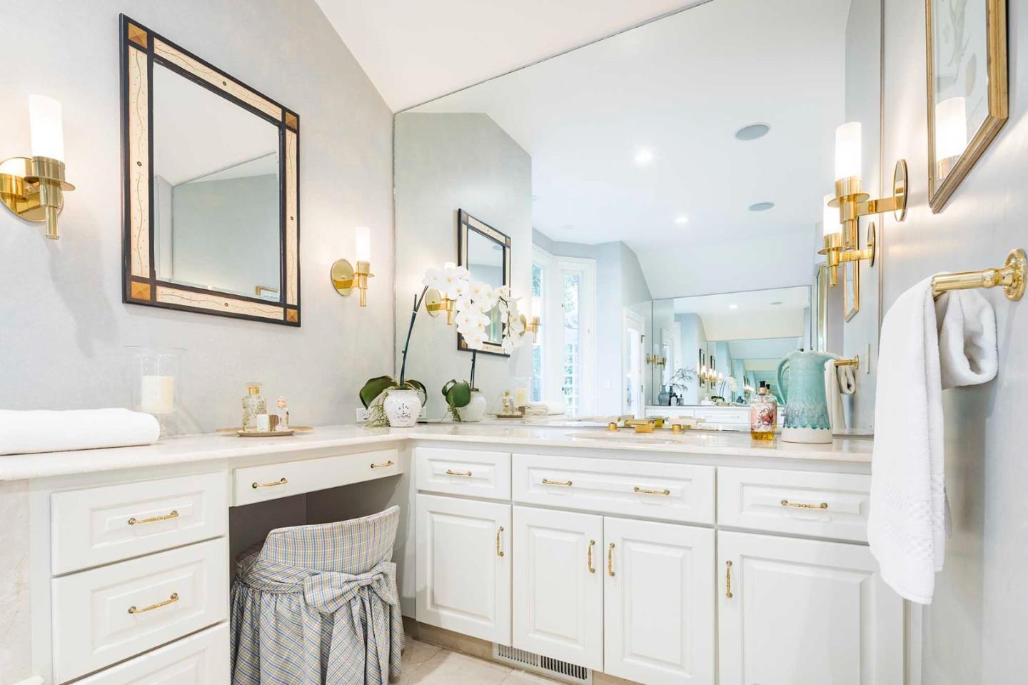 11491 Old Ranch Road Los Altos Hills, CA 94024 - Photo 11 of 52 a bathroom with a double vanity sink and a mirror