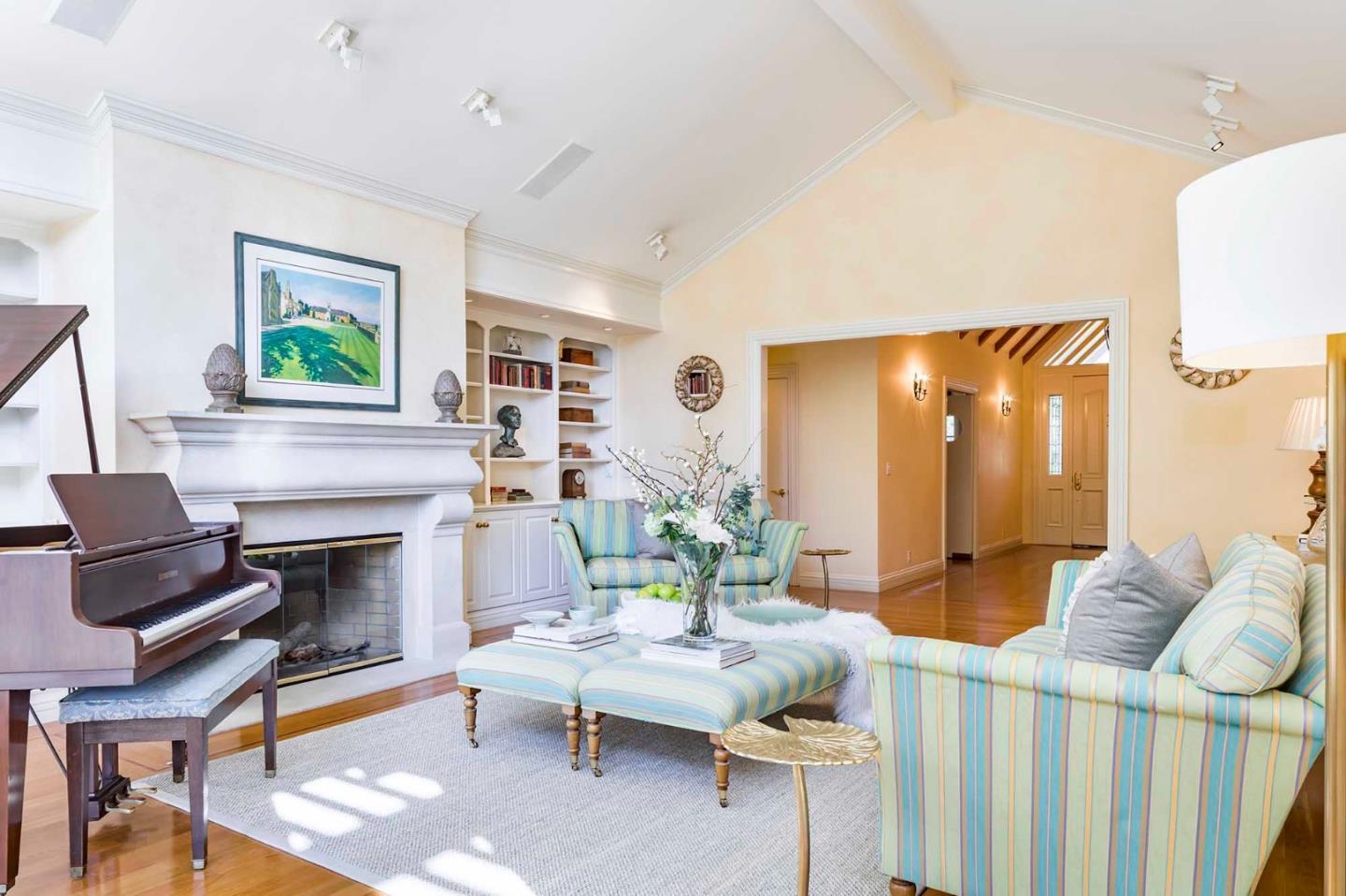 11491 Old Ranch Road Los Altos Hills, CA 94024 - Photo 15 of 52 a living room with furniture a fireplace and a flat screen tv