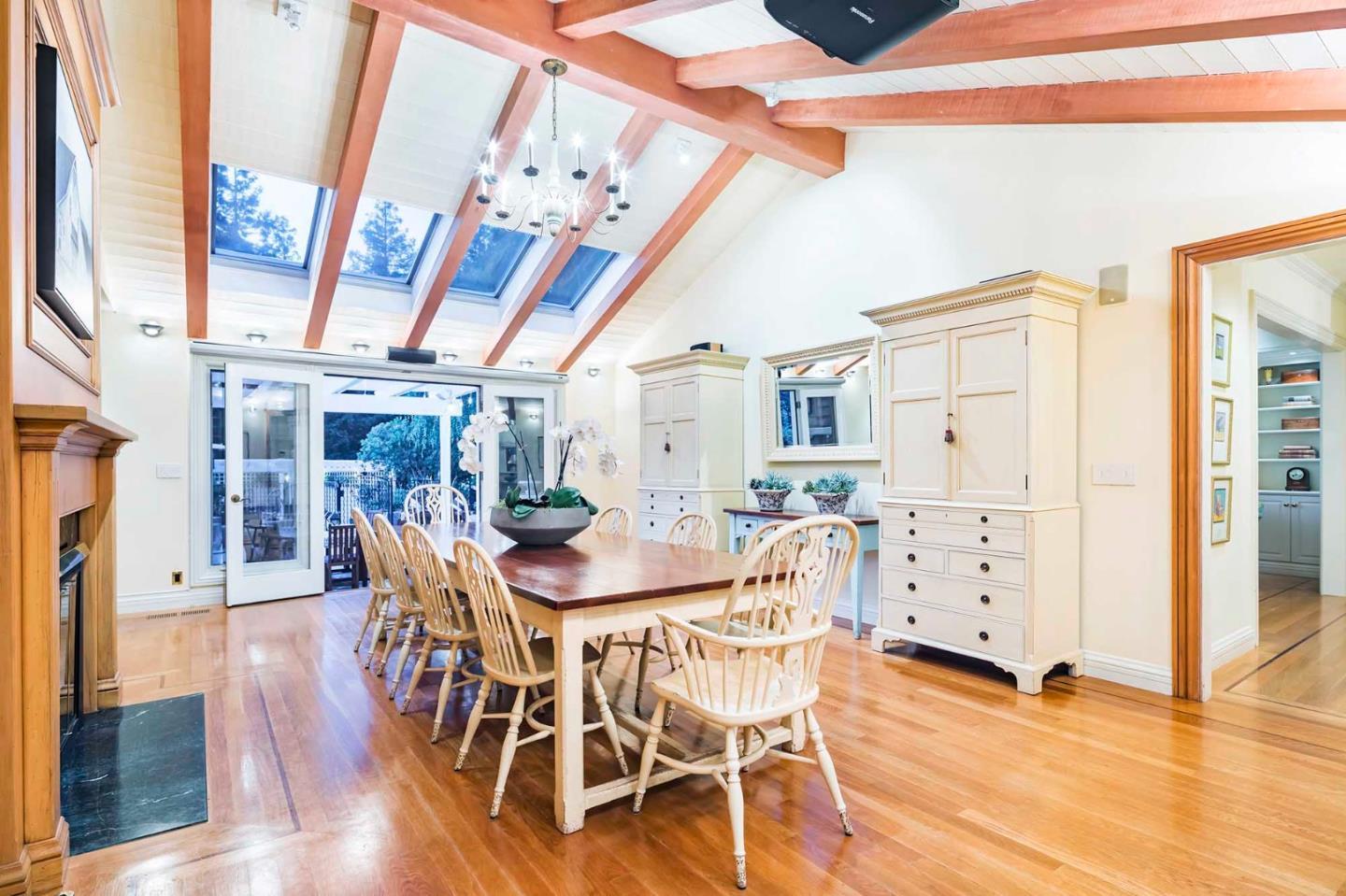 11491 Old Ranch Road Los Altos Hills, CA 94024 - Photo 20 of 52 a view of a dining room with furniture and wooden floor