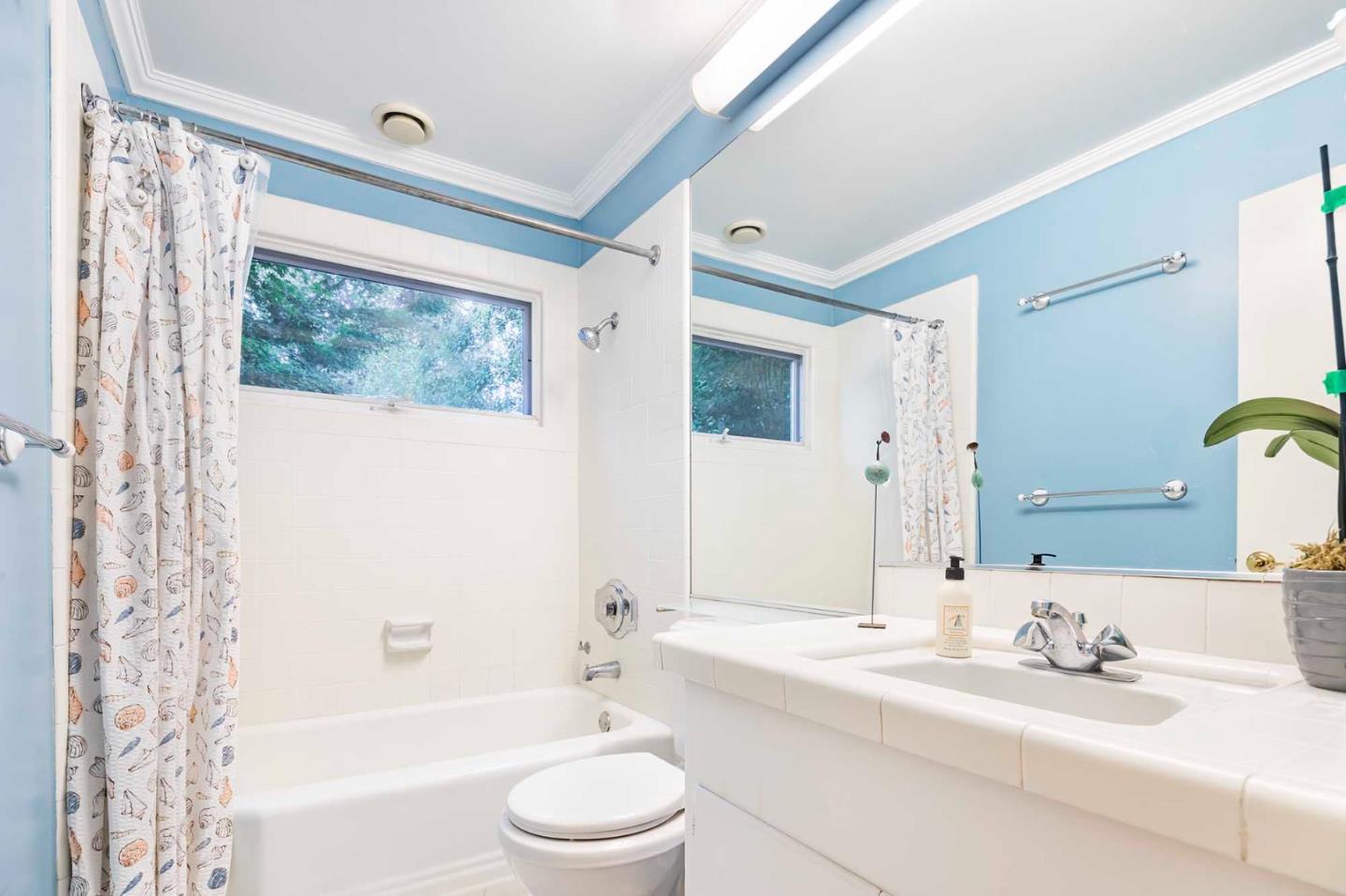 11491 Old Ranch Road Los Altos Hills, CA 94024 - Photo 30 of 52 a bathroom with a bathtub shower sink vanity mirror and toilet