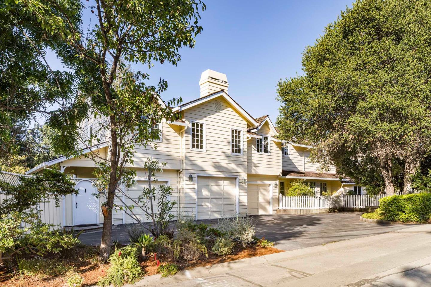 11491 Old Ranch Road Los Altos Hills, CA 94024 - Photo 44 of 52 a front view of a house with a yard and garage
