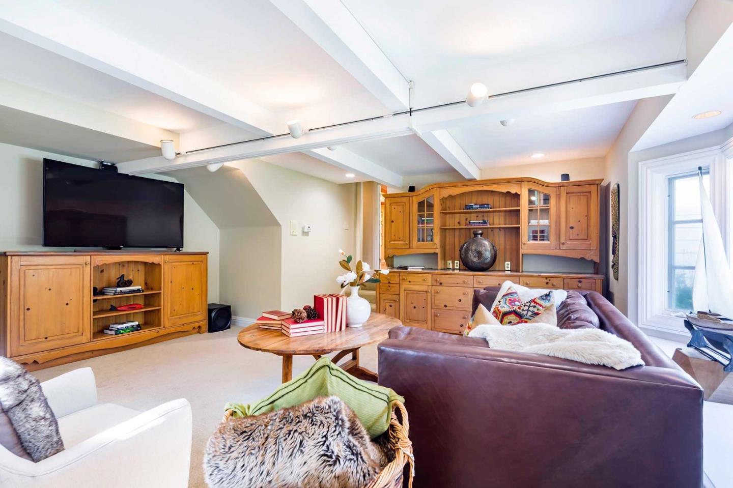 11491 Old Ranch Road Los Altos Hills, CA 94024 - Photo 48 of 52 a bedroom with furniture and a flat screen tv