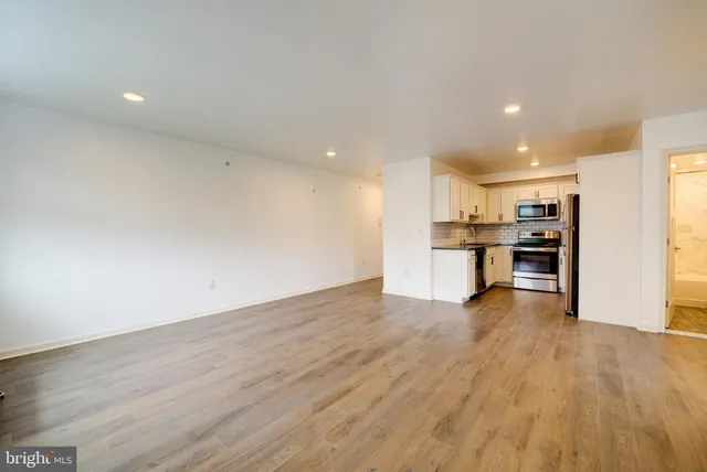 a view of kitchen with wooden floor