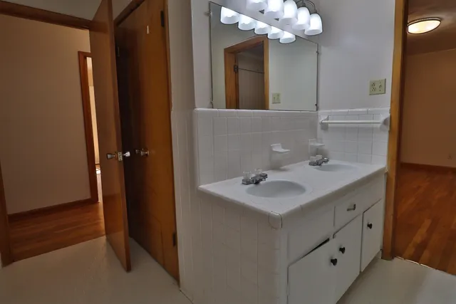 a bathroom with a shower and a sink