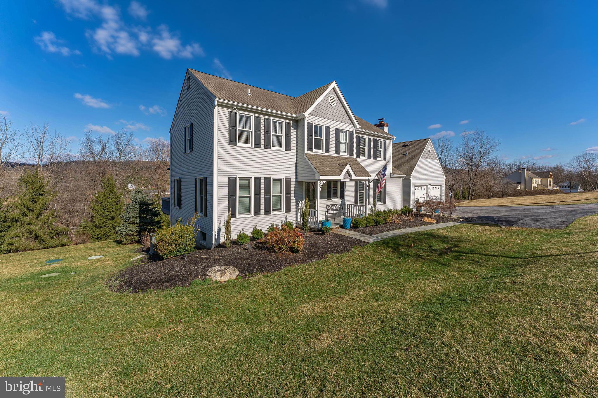 8 Matthews Run Road Chester Springs, PA 19425 - Photo 2 of 80 a front view of a house with a garden