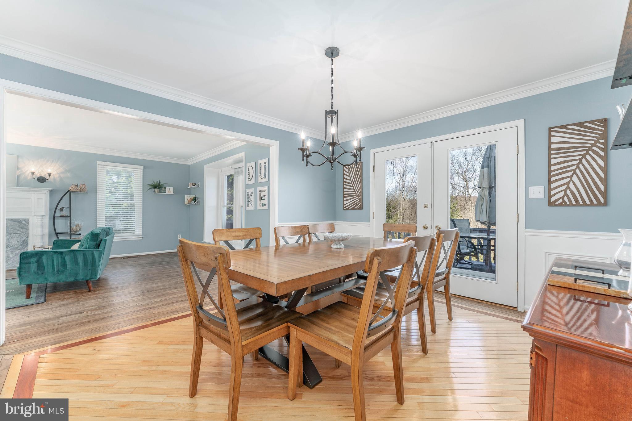8 Matthews Run Road Chester Springs, PA 19425 - Photo 23 of 80 a dining room with furniture a chandelier and wooden floor