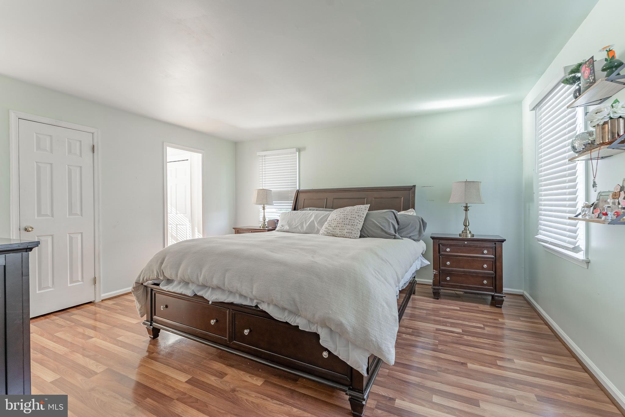 8 Matthews Run Road Chester Springs, PA 19425 - Photo 41 of 80 a bedroom with a bed and wooden floor