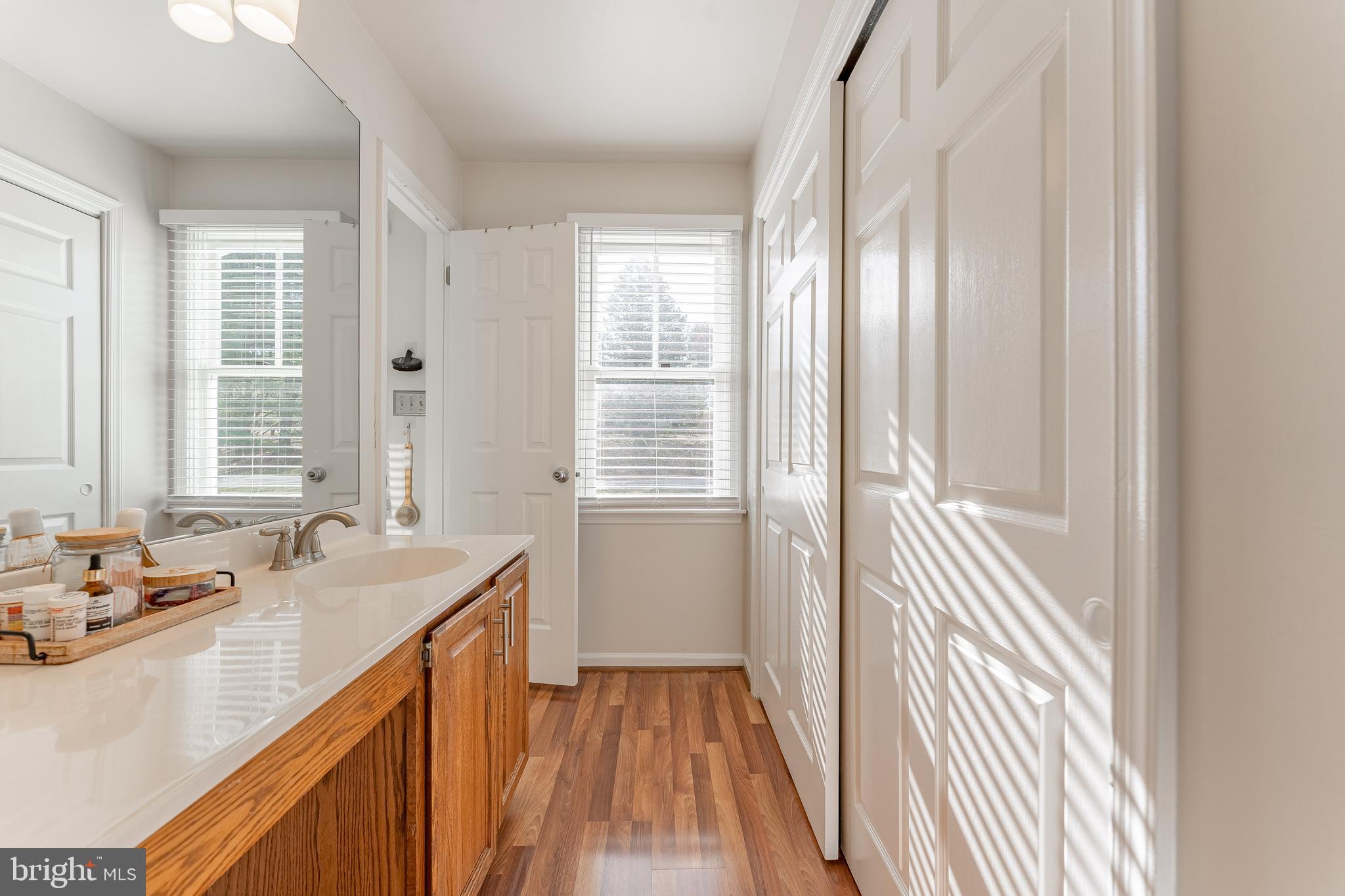 8 Matthews Run Road Chester Springs, PA 19425 - Photo 46 of 80 a bathroom with a granite countertop sink and a large mirror
