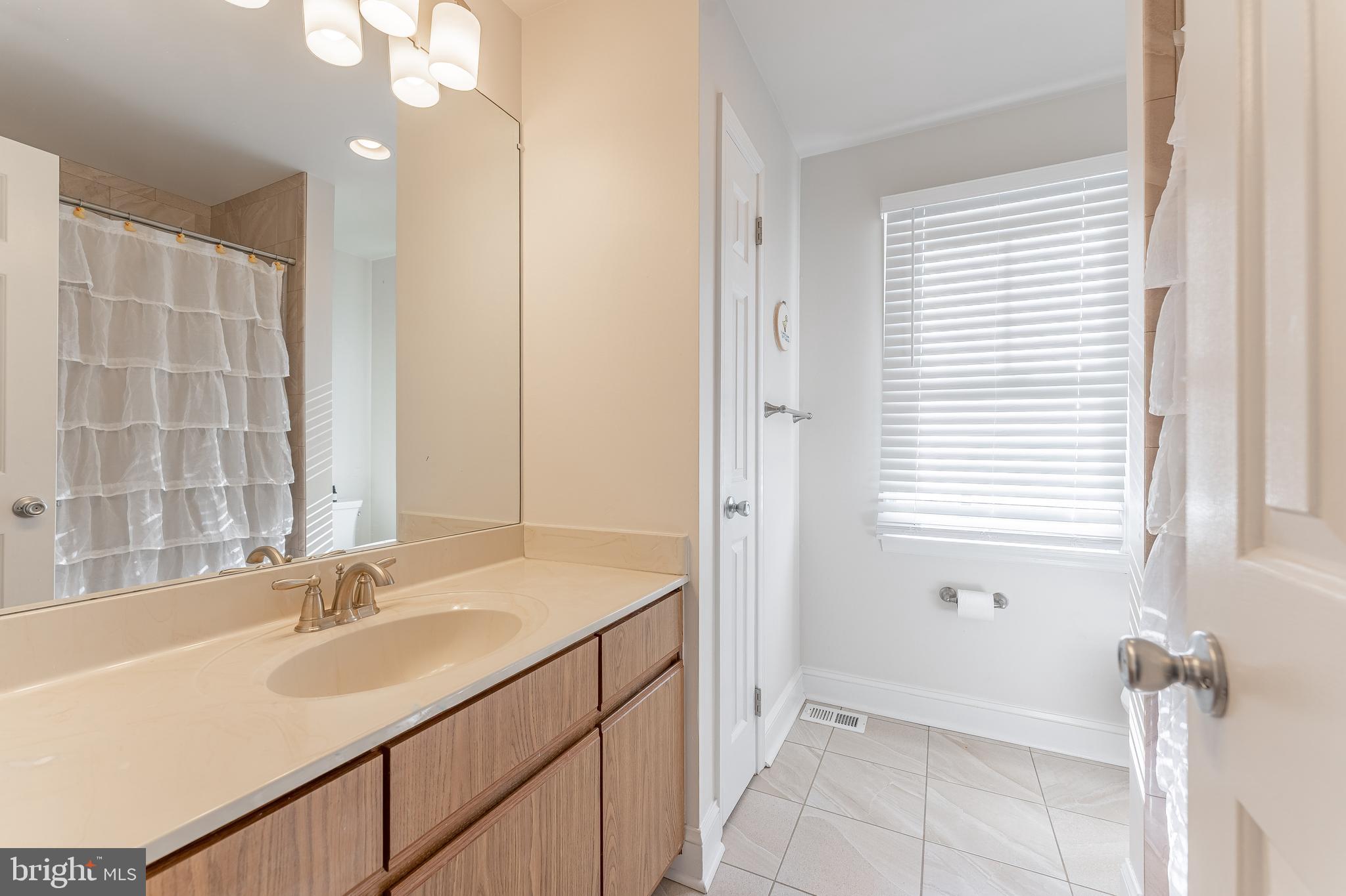 8 Matthews Run Road Chester Springs, PA 19425 - Photo 52 of 80 a bathroom with a sink and a mirror