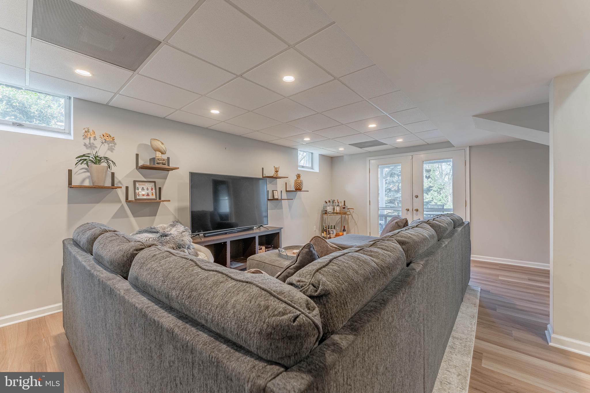 8 Matthews Run Road Chester Springs, PA 19425 - Photo 57 of 80 a living room with furniture and a flat screen tv