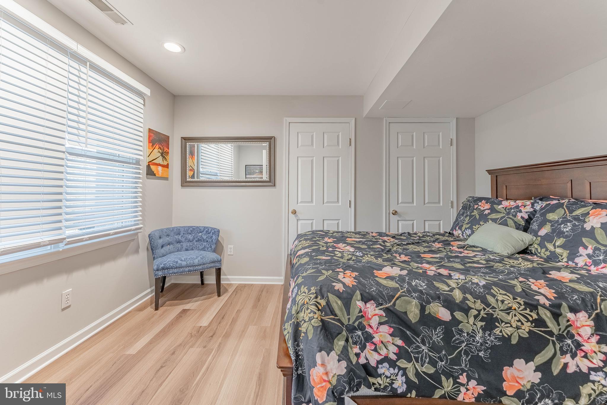 8 Matthews Run Road Chester Springs, PA 19425 - Photo 58 of 80 a bed sitting in a bedroom next to a window and a chair