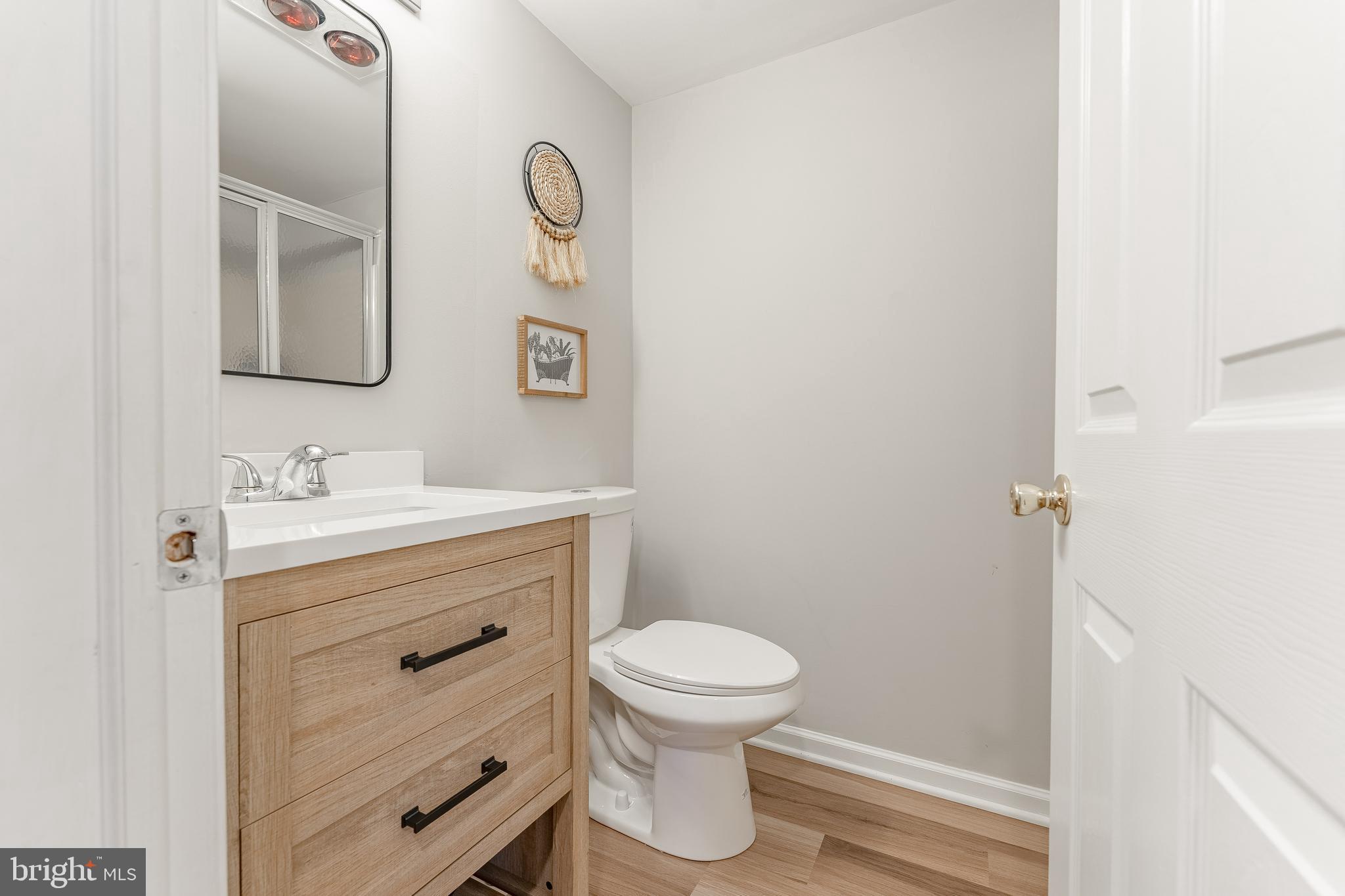 8 Matthews Run Road Chester Springs, PA 19425 - Photo 61 of 80 a bathroom with a sink a toilet and a mirror