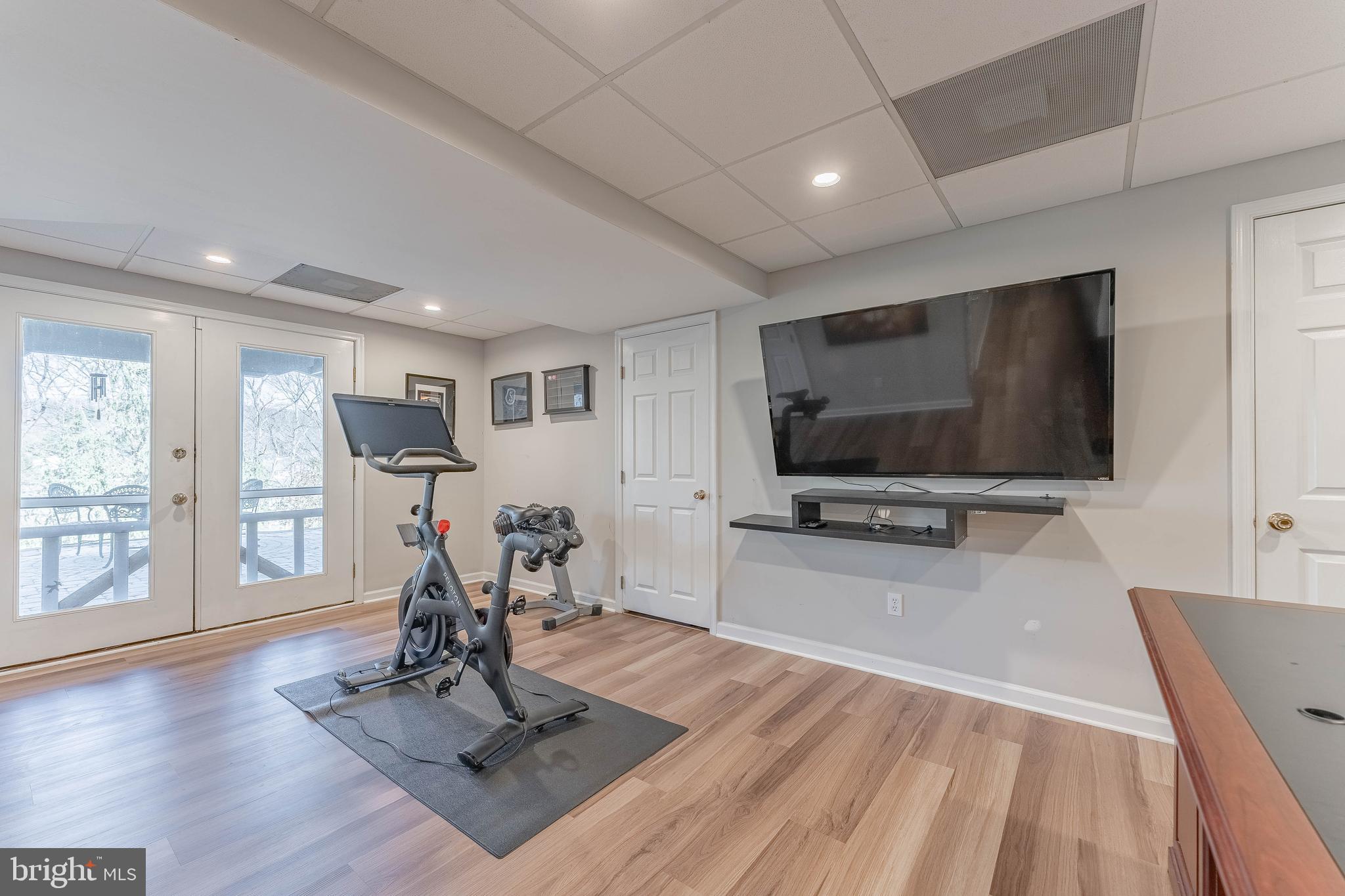 8 Matthews Run Road Chester Springs, PA 19425 - Photo 62 of 80 a living room with furniture and a flat screen tv