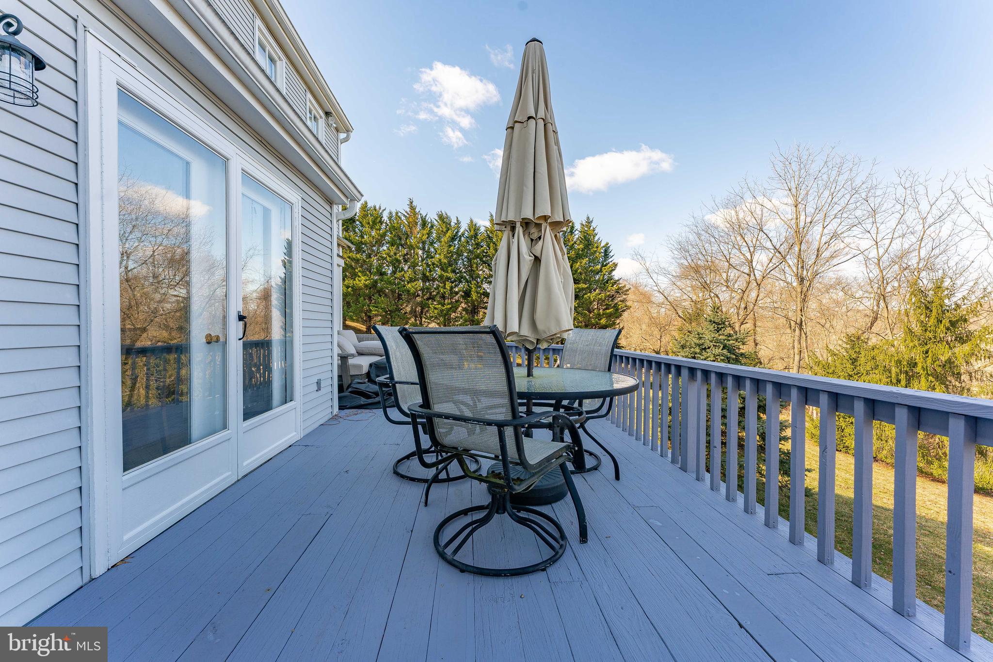 8 Matthews Run Road Chester Springs, PA 19425 - Photo 74 of 80 a view of a dinning table and chairs in patio of the house