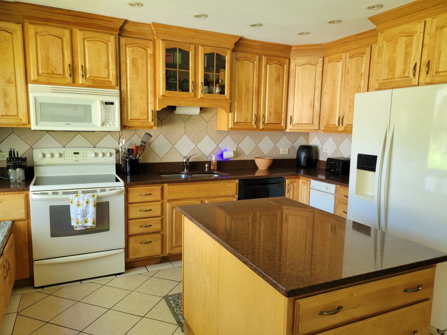 1322 Elder Road Homewood, IL 60430 - Photo 12 of 27 a kitchen with stainless steel appliances granite countertop a sink a stove and a refrigerator