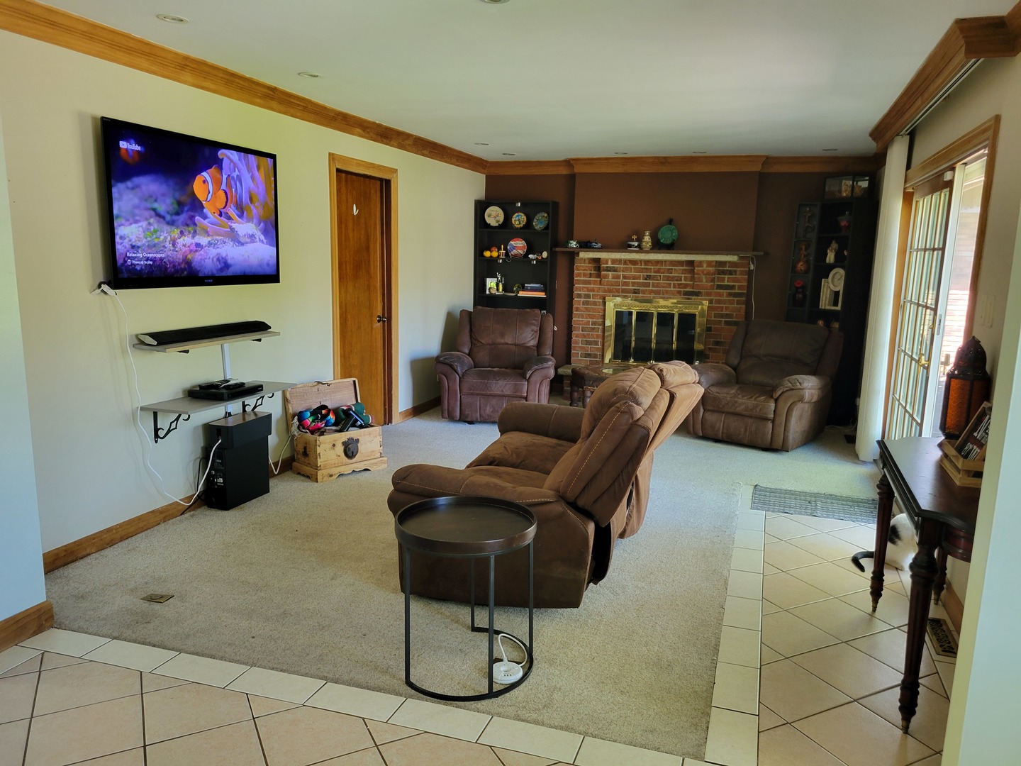 1322 Elder Road Homewood, IL 60430 - Photo 16 of 27 a living room with furniture a flat screen tv and a fireplace