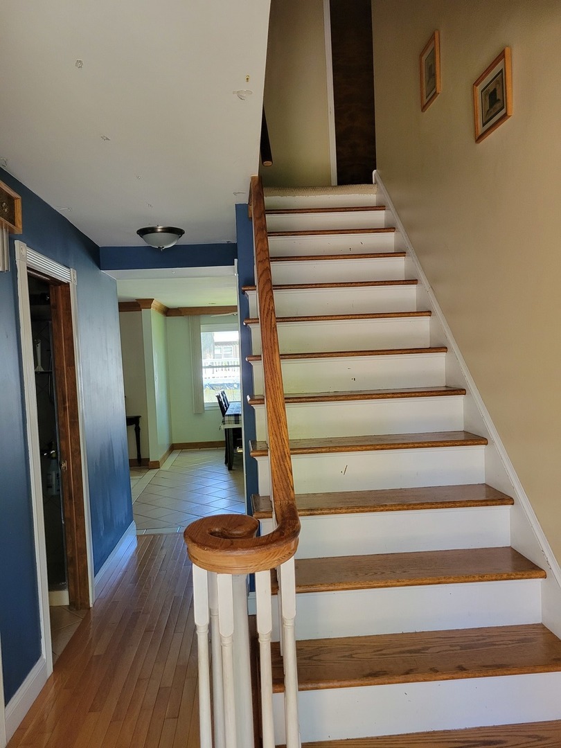 1322 Elder Road Homewood, IL 60430 - Photo 19 of 27 a view of entryway and hall with wooden floor