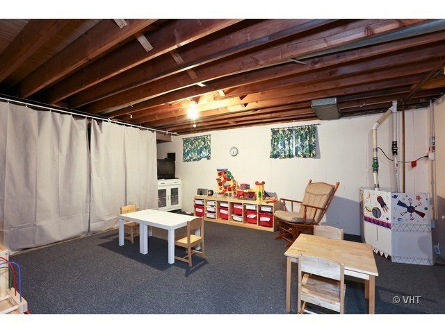 1322 Elder Road Homewood, IL 60430 - Photo 26 of 27 a living room with furniture and a wooden floor