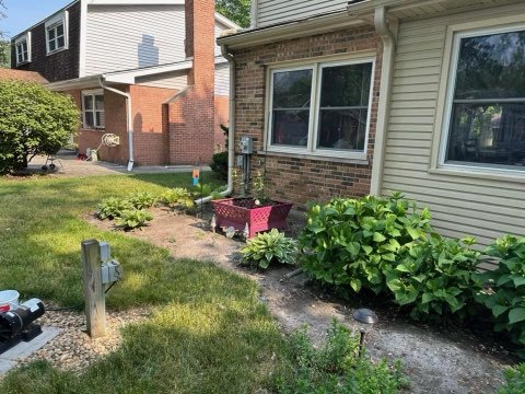 1322 Elder Road Homewood, IL 60430 - Photo 7 of 27 a view of a backyard with plants