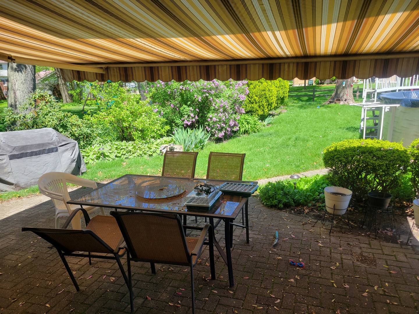 1322 Elder Road Homewood, IL 60430 - Photo 9 of 27 a backyard of a house with a garden and outdoor seating