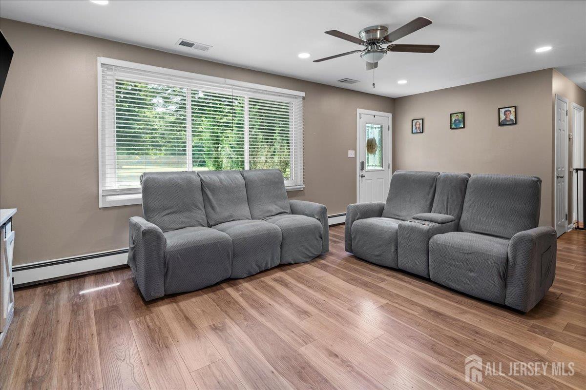 a living room with furniture and a large window