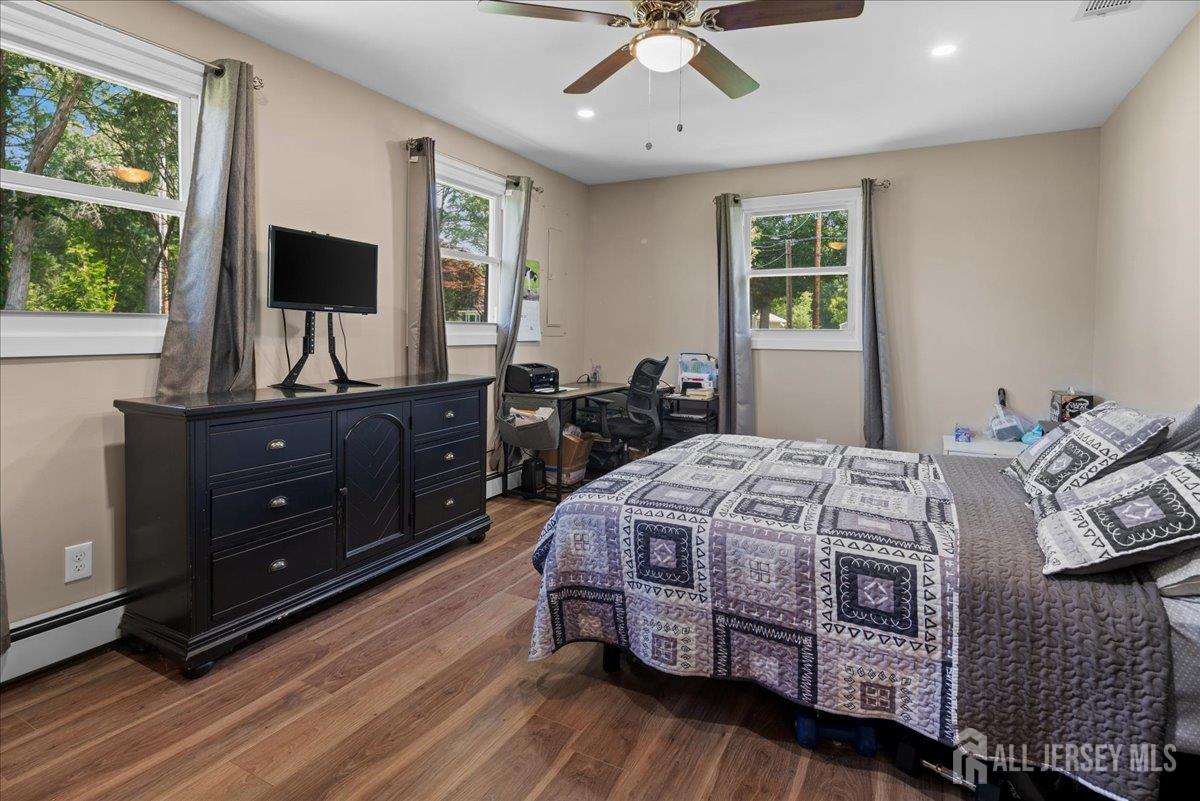 5 Applegate Road Jobstown, NJ 08041 - Photo 11 of 34 a bedroom with a bed window and a flat screen tv