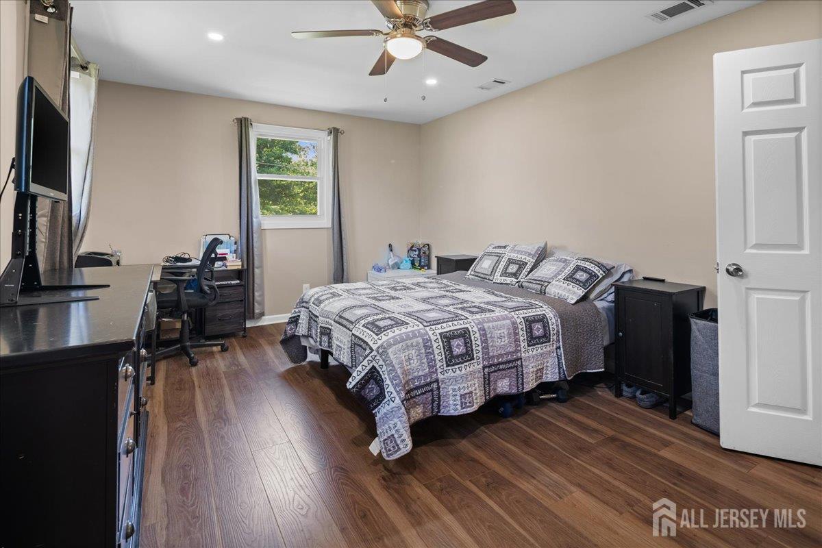 5 Applegate Road Jobstown, NJ 08041 - Photo 12 of 34 a bedroom with a bed a flat screen tv and dresser