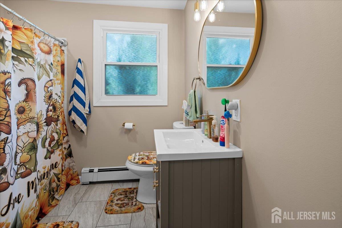 5 Applegate Road Jobstown, NJ 08041 - Photo 15 of 34 a bathroom with a sink a mirror and a toilet