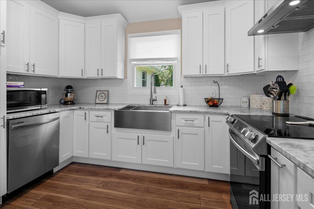 5 Applegate Road Jobstown, NJ 08041 - Photo 8 of 34 a kitchen with white cabinets stainless steel appliances and sink
