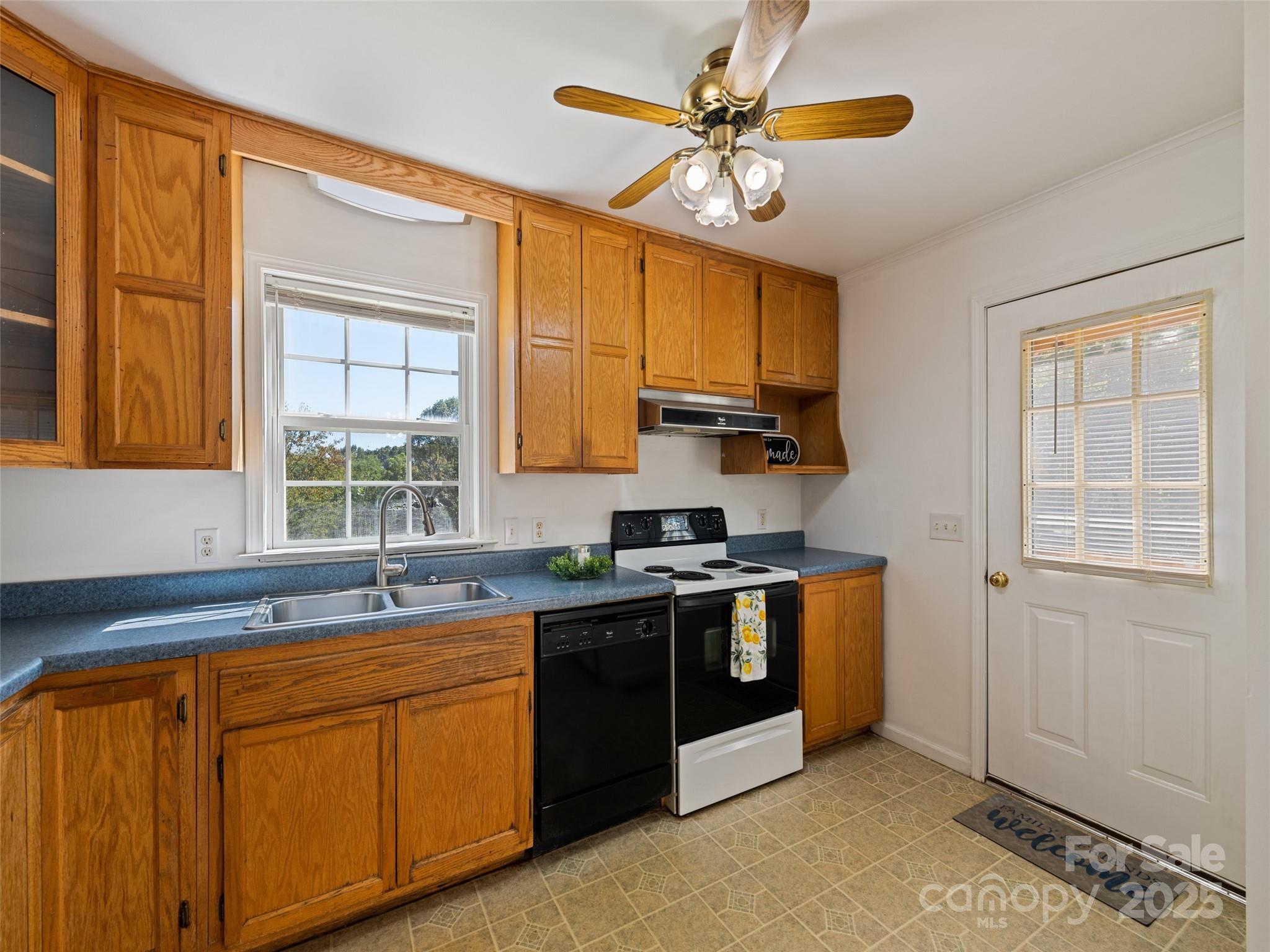 2884 Thickety Road Clyde, NC 28721 - Photo 12 of 20 a kitchen with stainless steel appliances granite countertop a sink a stove and a refrigerator