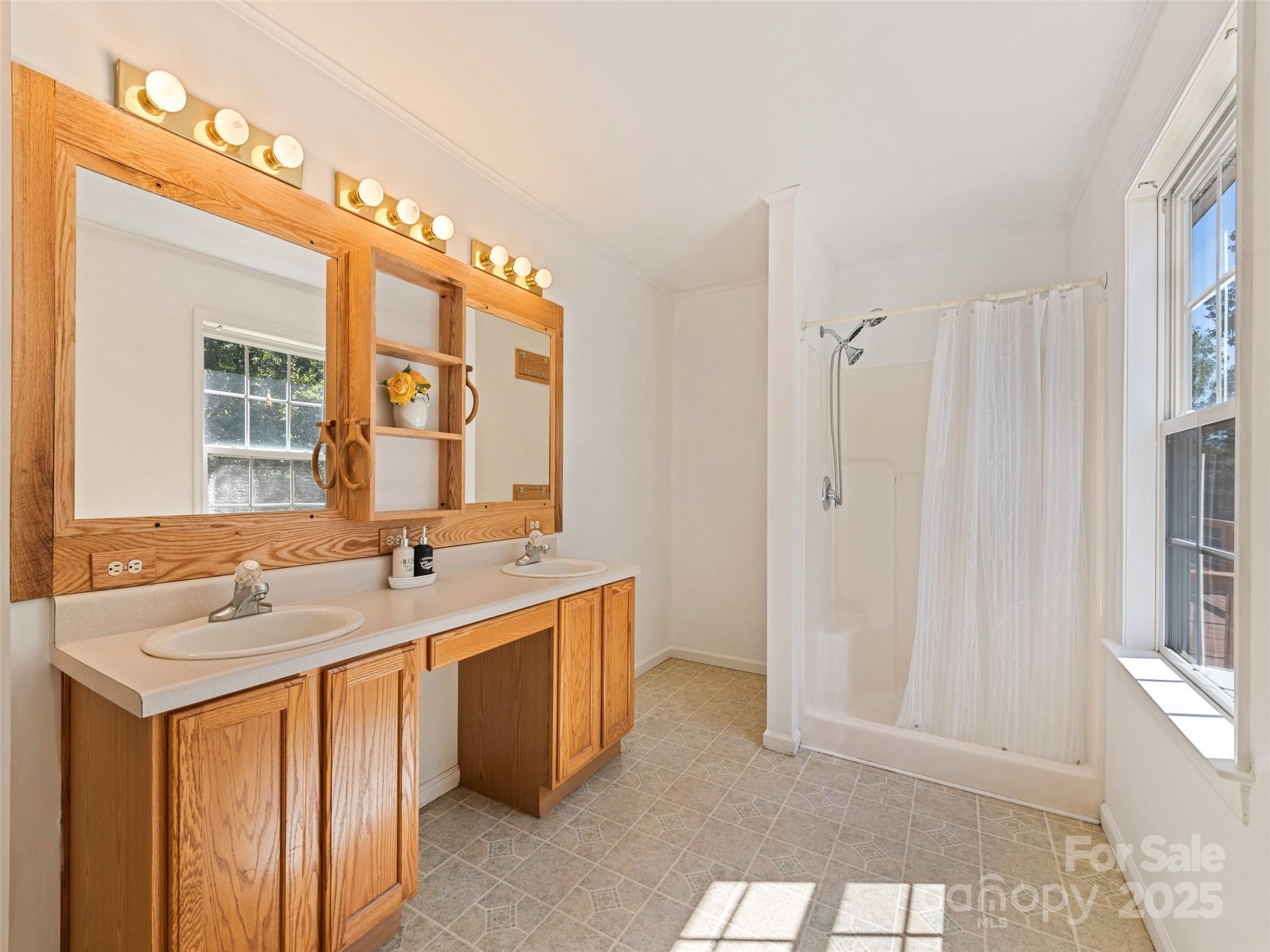 2884 Thickety Road Clyde, NC 28721 - Photo 15 of 20 a bathroom with a sink double vanity and a mirror