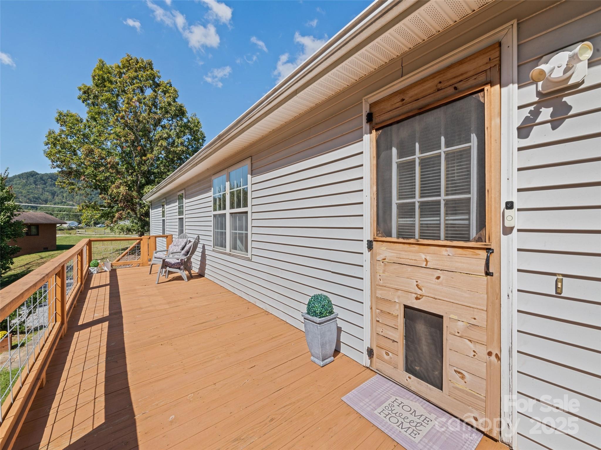 2884 Thickety Road Clyde, NC 28721 - Photo 3 of 20 a balcony view with a outdoor seating