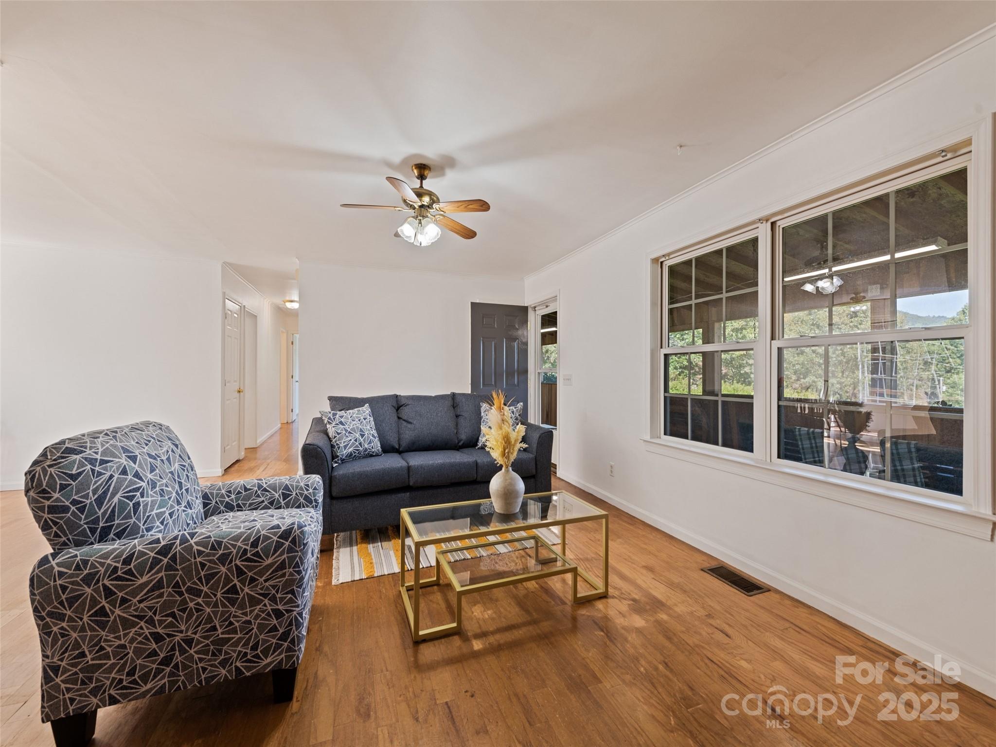 2884 Thickety Road Clyde, NC 28721 - Photo 9 of 20 a living room with furniture and a large window