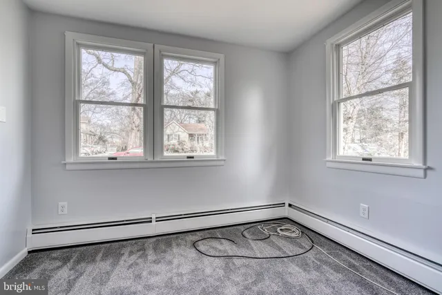 a bathroom with a shower and a toilet
