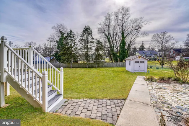 a view of a lake with a house in the background