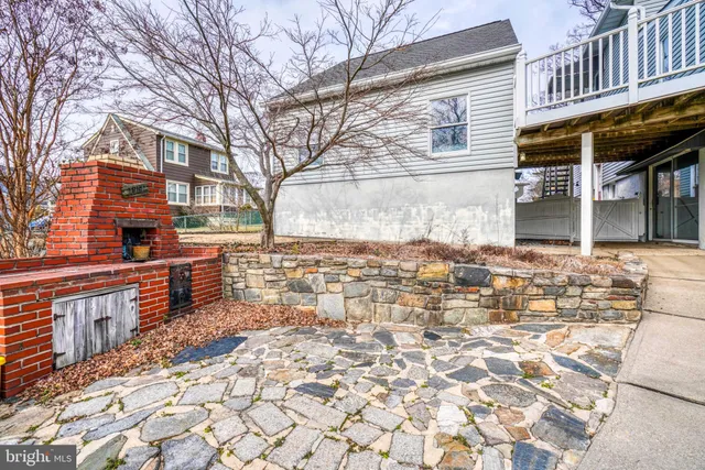 a view of a swimming pool and trees in the background