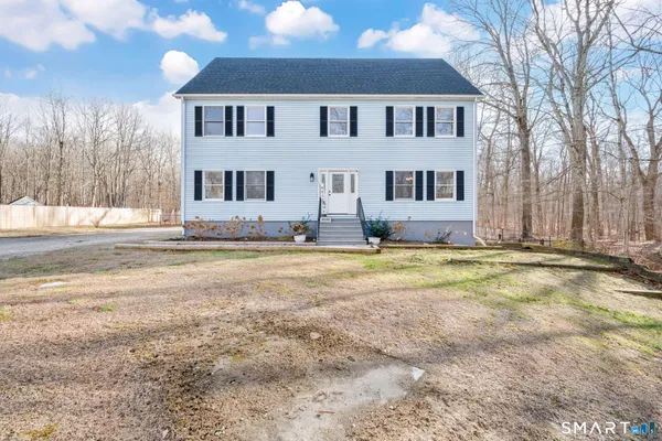 a front view of house with yard