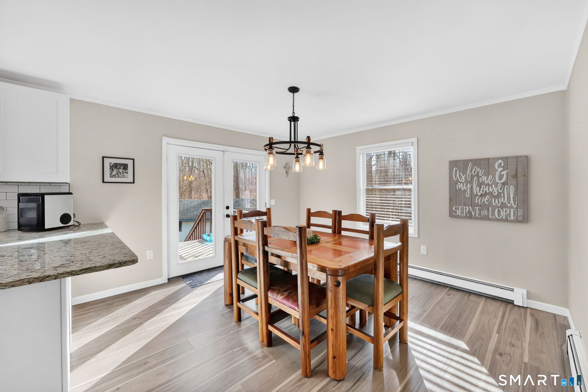 97 Bass Road Windham, CT 06280 - Photo 13 of 40 a view of a dining room with furniture and wooden floor