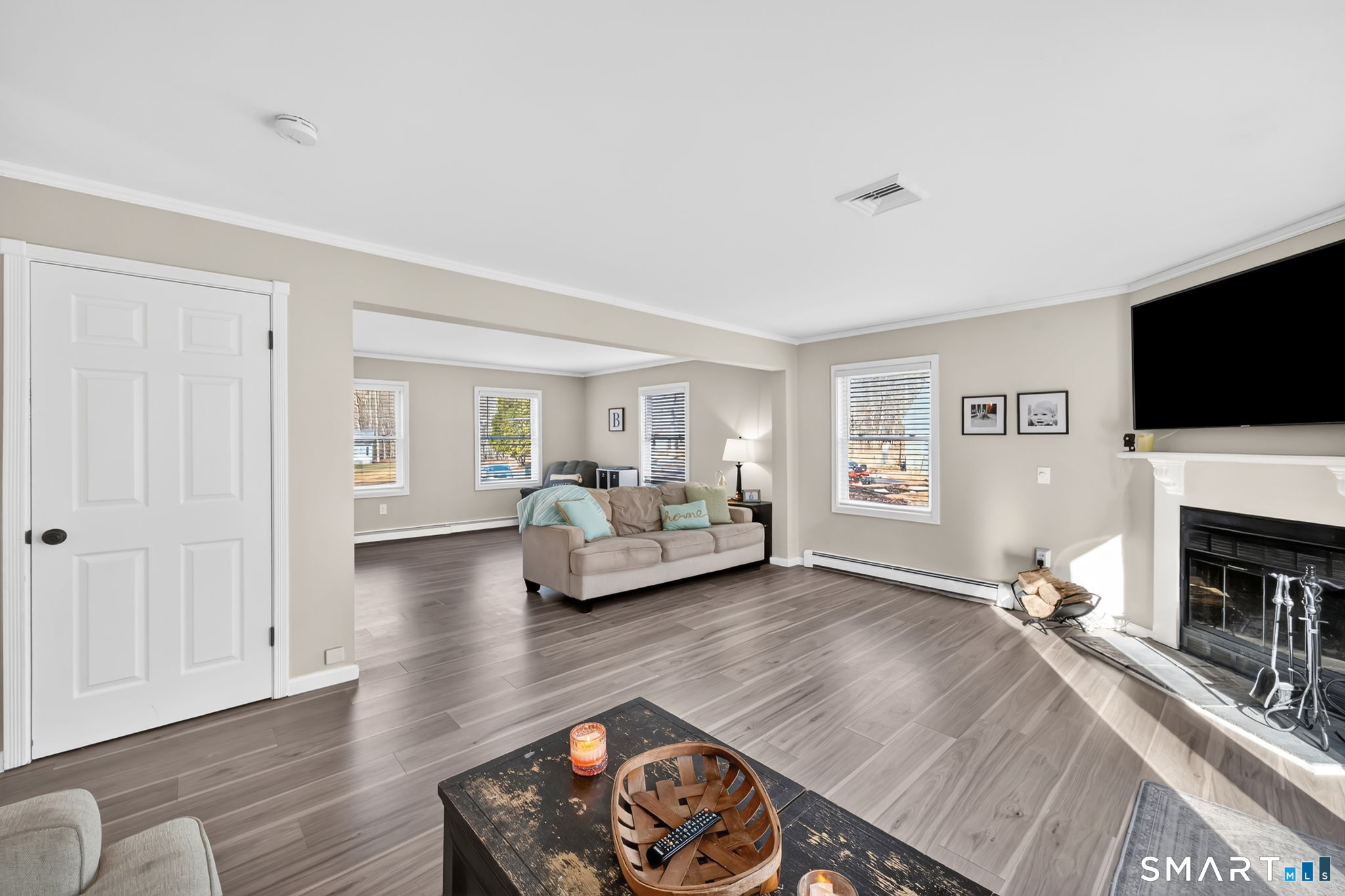 97 Bass Road Windham, CT 06280 - Photo 16 of 40 a living room with furniture and a flat screen tv