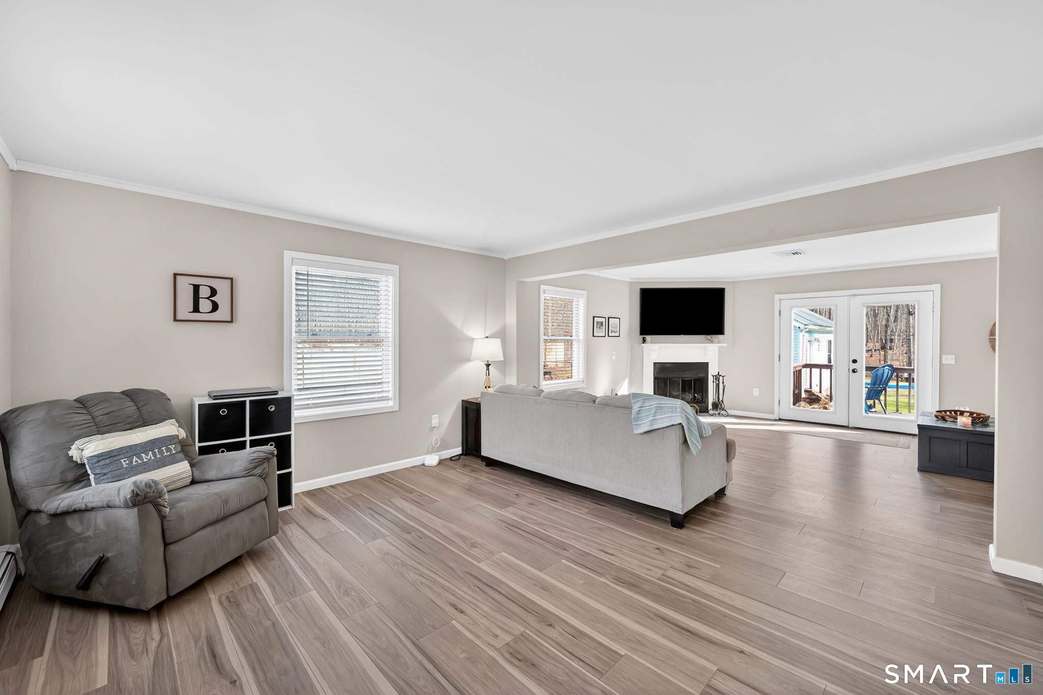 97 Bass Road Windham, CT 06280 - Photo 20 of 40 a living room with furniture and a flat screen tv