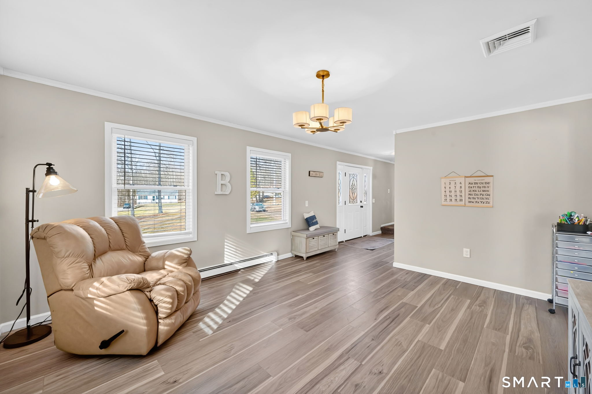 97 Bass Road Windham, CT 06280 - Photo 26 of 40 a living room with furniture and wooden floor