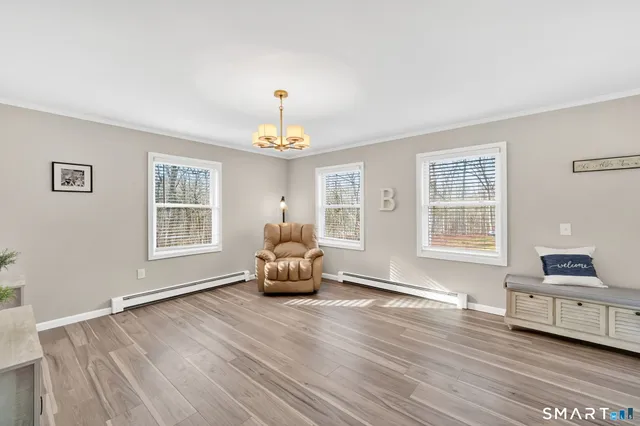 a living room with furniture and a window