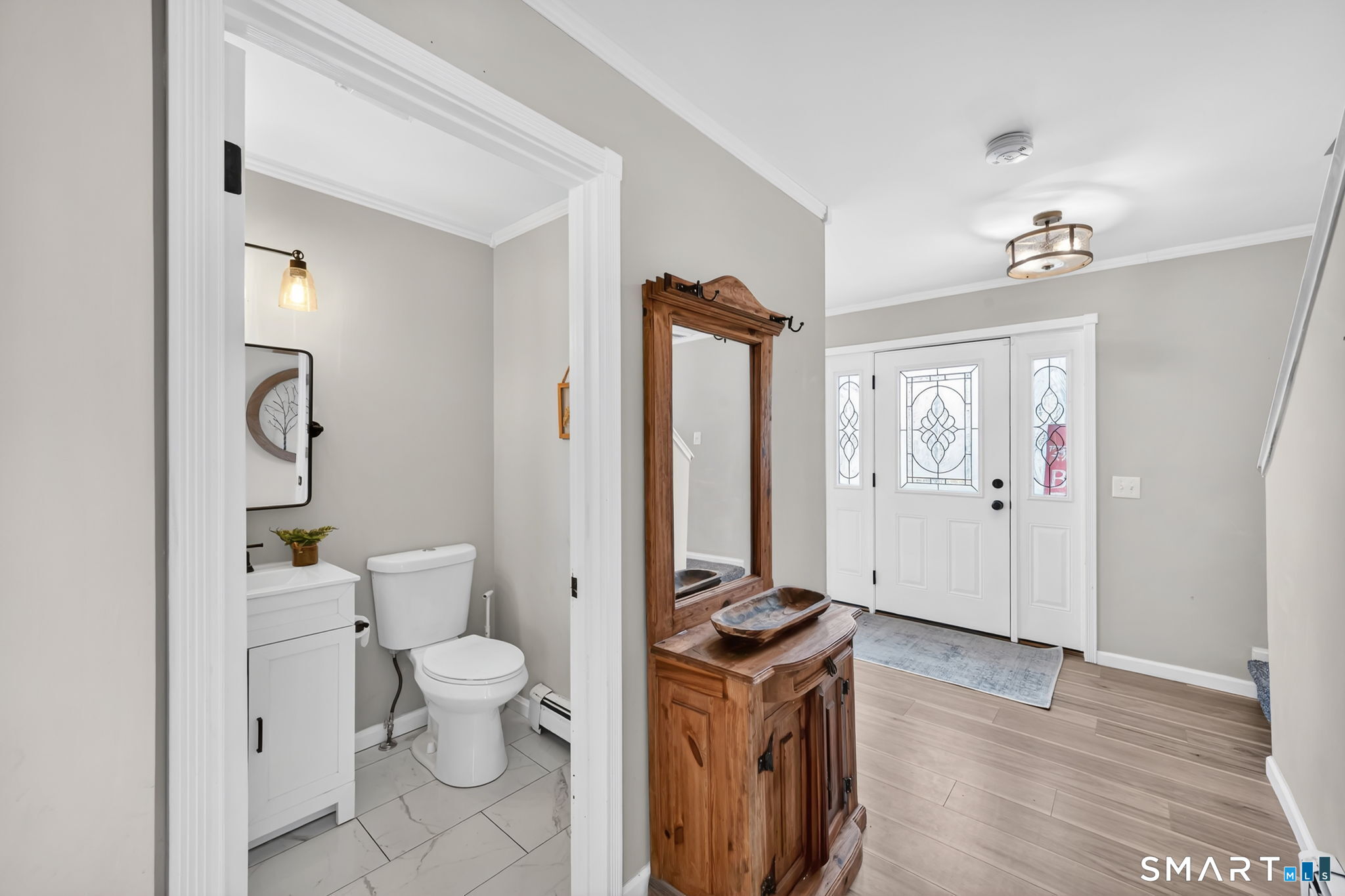 97 Bass Road Windham, CT 06280 - Photo 29 of 40 a bathroom with a toilet sink and a mirror