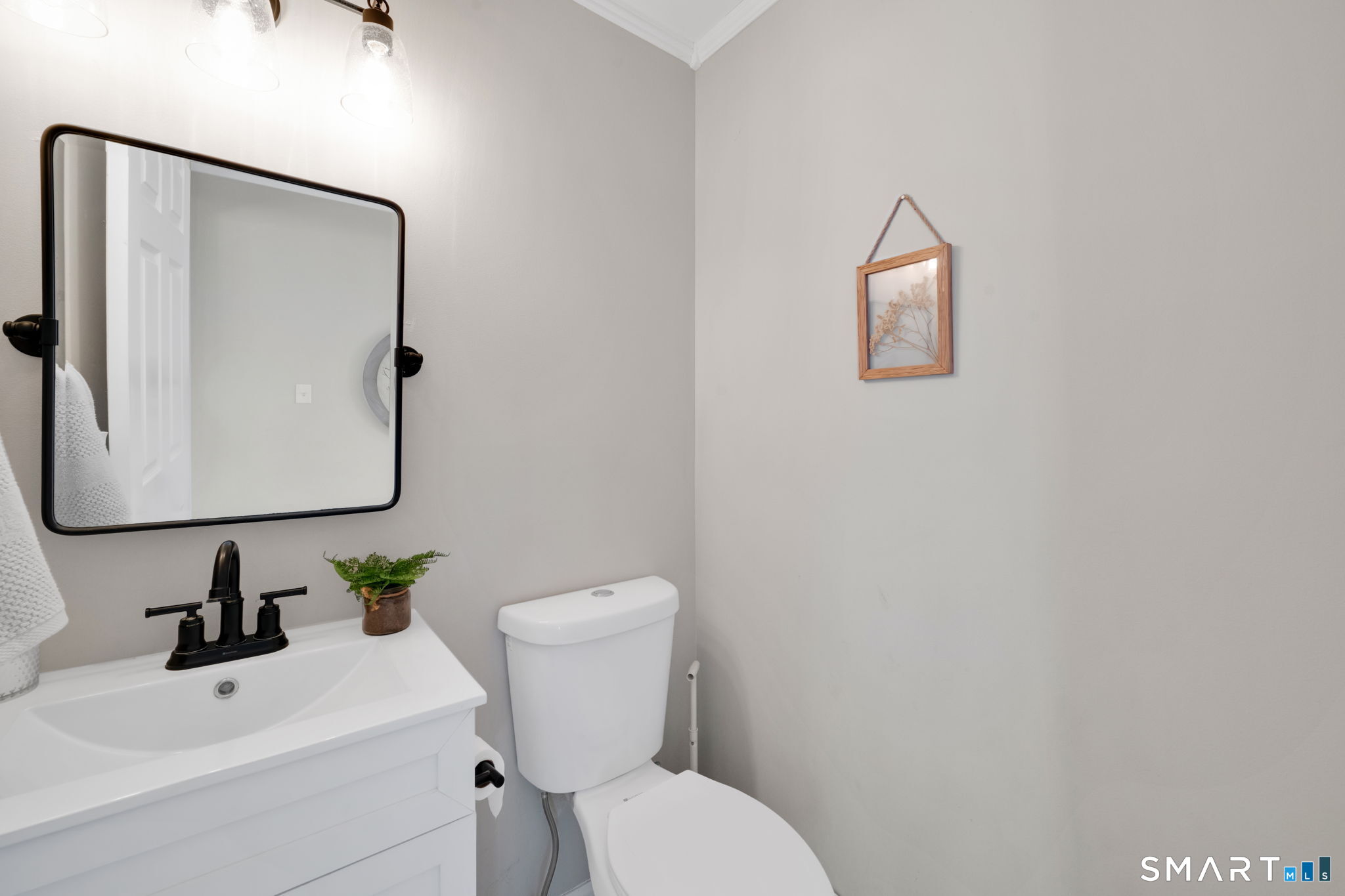 97 Bass Road Windham, CT 06280 - Photo 30 of 40 a white toilet sitting next to a bathroom sink