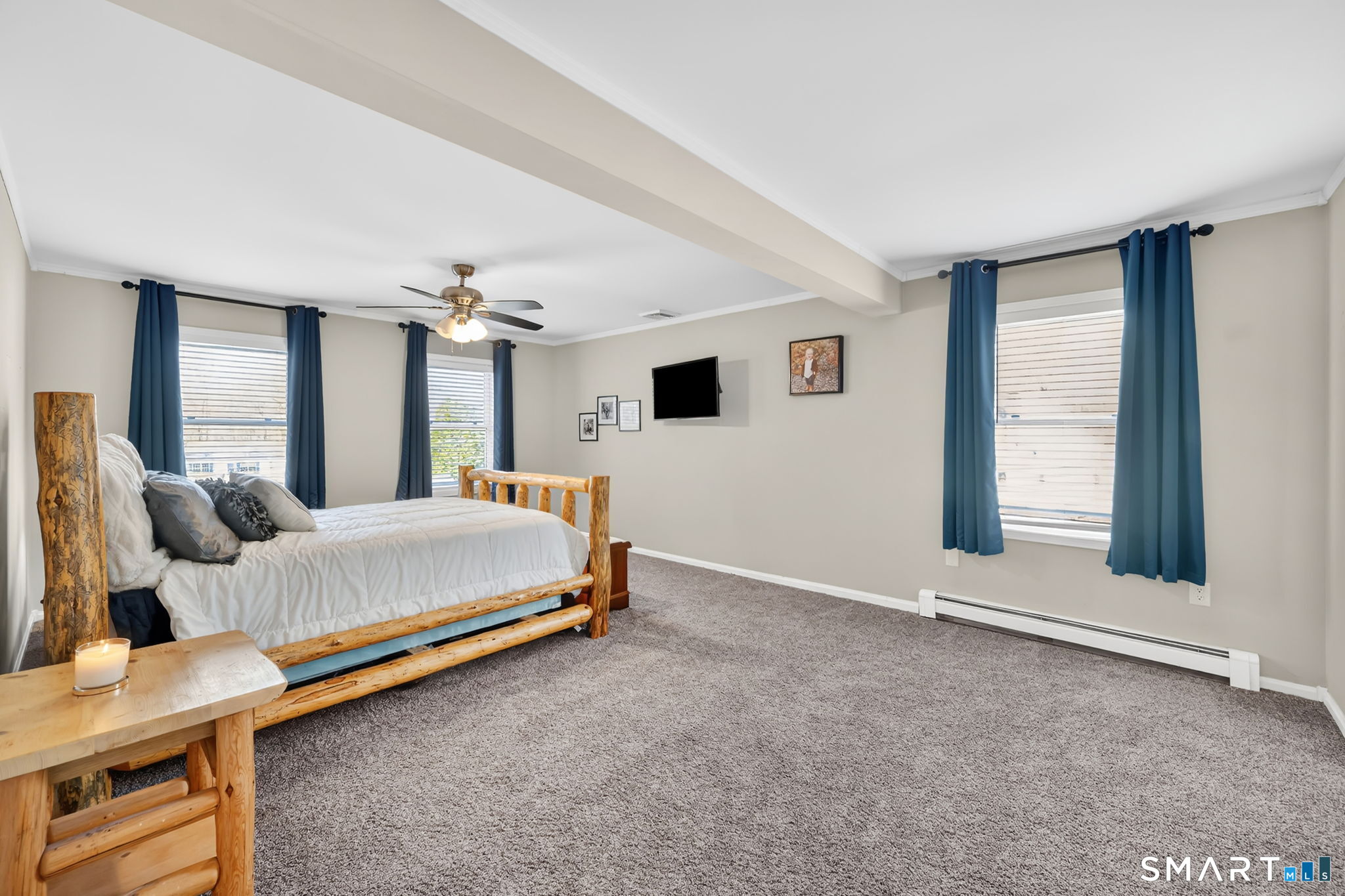 97 Bass Road Windham, CT 06280 - Photo 31 of 40 a spacious bedroom with a bed and window