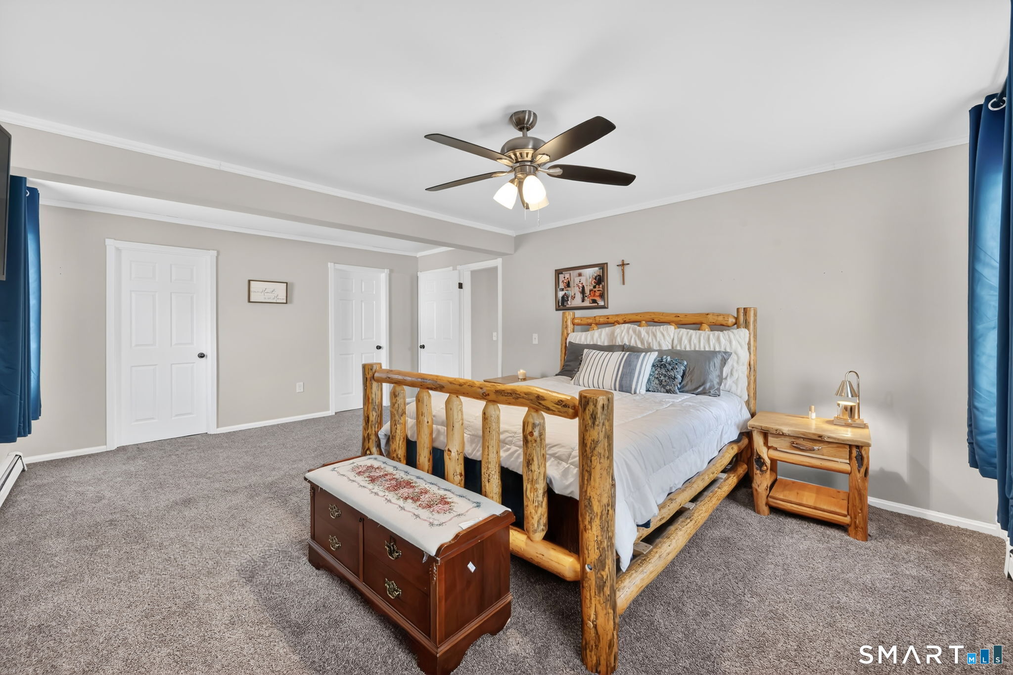 97 Bass Road Windham, CT 06280 - Photo 32 of 40 a bed room with a bed and a ceiling fan